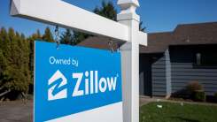 home with "owned by zillow" sign in front