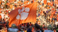 A flag displaying the Clemson Tigers logo against a crowd at Clemson Memorial Stadium in Clemson, South Carolina