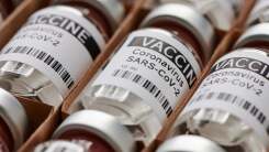 bottles of COVID vaccine boxed up to be shipped to pharmacies