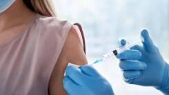 woman receiving a vaccine in her upper arm
