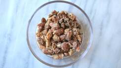 Candied mixed nuts in a small bowl.