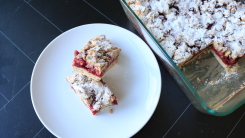 Cranberry jam bars on a plate.