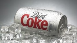 A can of Diet Coke sitting on ice.