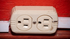 white electrical outlet on red wall
