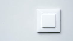 light switch on gray wall