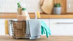 basket with cleaning supplies, in kitchen