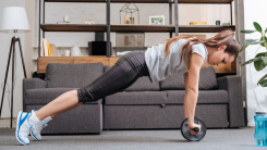 woman exercising with ab wheel