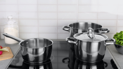 pots and pans on glass stovetop