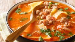 Close-up of a bowl of lasagna soup.