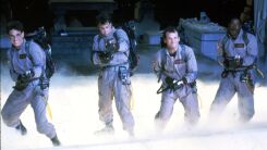 A screenshot from ghostbusters of the four ghostbuster firing their proton packs