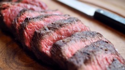 Sliced steak on a cutting board