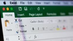 A closeup of the Microsoft Excel toolbar open on a monitor