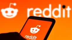 reddit logo on phone and screen