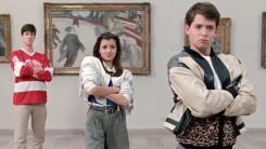 A screenshot from Ferris Bueller's Day Off of Alan Ruck, Mia Sara, and Matthew Broderick in an art gallery