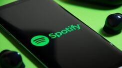 A phone displaying the Spotify app logo