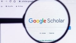 google scholar website seen under magnifying glass