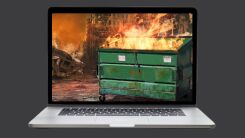 An image of a burning dumpster on a laptop screen