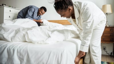 couple making bed