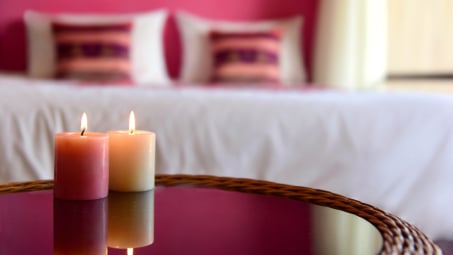 Two candles in bedroom