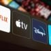 Netflix, Apple TV, Disney Plus and Paramount Plus logo is displayed on a TV screen.