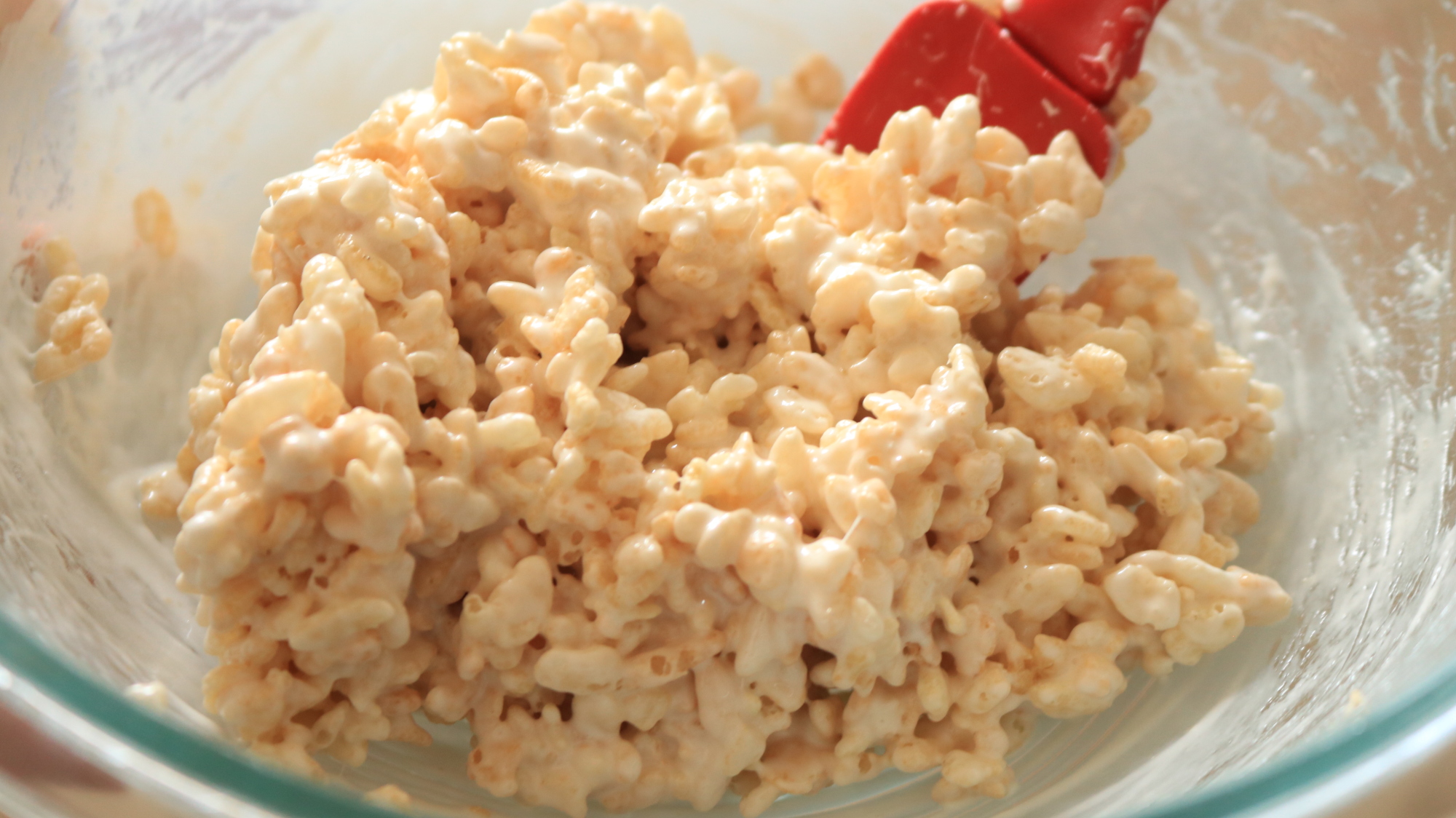 A small mound of Rice Krispies Treat mixture in a bowl.