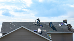 men replacing roof of a house