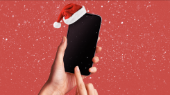 A smartphone wearing a Santa hat.