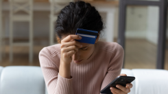 Upset woman with credit card