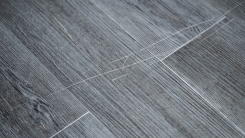 Scratches in grey laminate flooring