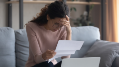 Woman stressed over finances.