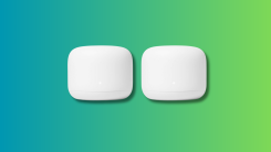 Google Nest Wifi routers on a teal and green gradient background.