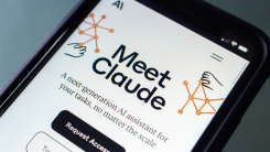 A photograph of a phone screen displaying the Claude AI interface