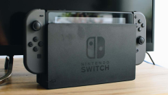 A docked black Nintendo Switch