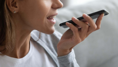 woman singing into iphone mic